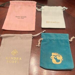 4 jewelry bags by Kate Spade/enewton/Kemdra Scott and Sparta